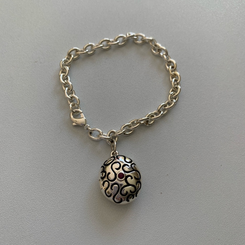Charm Bracelet Silver Tone Locket 7 Inch Oval Locket Charm might be Brighton.